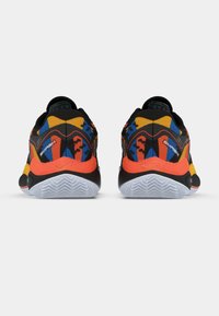 Black athletic shoes featuring a colorful design with orange, blue, and yellow accents. Rubber sole with a textured surface for grip.