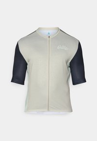Jersey de ciclismo de manga corta en beige claro con mangas cortas en azul marino. Presenta una cremallera frontal y bordado del logo en el pecho.