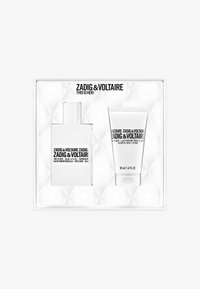 Geurenset in een doos met een doorzichtig glazen flesje met een witte dop en een witte tube voor bodylotion, beide voorzien van zwarte tekst.