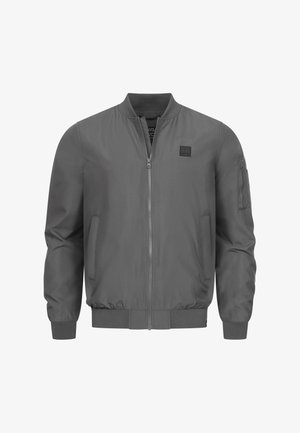 Szara kurtka bombowa z zamkiem z przodu, ściągaczami przy mankietach i u dołu, bocznymi kieszeniami oraz kieszenią na zamek na lewym rękawie. Gładkie wykończenie tkaniny.