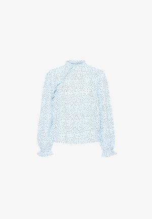 Blouse bleu clair à manches longues avec un col haut, ornée de pois noirs, d'un détail froncé sur le côté et de poignets élastiques.