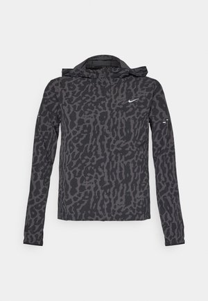 Nike jacket featuring a black and gray leopard print, lightweight fabric, zip front, hood, and long sleeves with subtle branding accents.