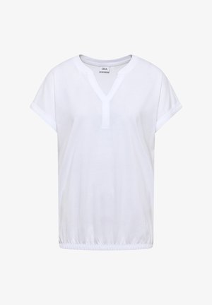 Blouse blanche à manches courtes avec col en V, poignets retroussés, ourlet élastique et une petite étiquette de marque à l'intérieur du col.