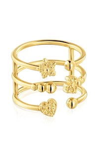 Gold-tone ring featuring multiple bands with textured accents including a heart, star, and rounded beads; smooth, polished finish.