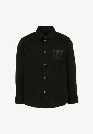 Chemise noire à manches longues avec col pointu, boutons décoratifs en forme d'étoile et lettres "JR" en relief sur la poitrine gauche.