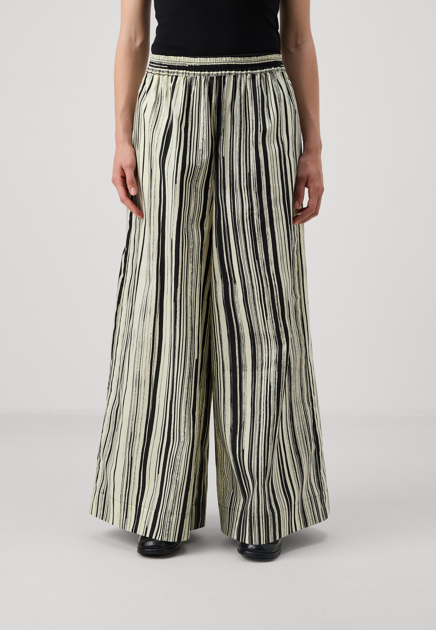 Marimekko KOHTI SILUETTI - Trousers - light yellow/black