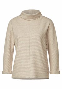 Beige tröja med hög krage, med horisontell ribbad textur, långa ärmar och vikta muddar. Enkelt, avslappnat silhuett.