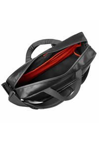 Schwarze wasserdichte Tasche mit orangefarbigem Innenfutter, ausgestattet mit zwei Griffen und einem Reißverschluss. Strukturierte Seitenfläche für besseren Halt und Langlebigkeit.