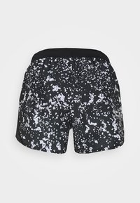 Short de sport noir avec imprimé éclaboussures blanches, ceinture élastique, vu de dos sur fond blanc uni.