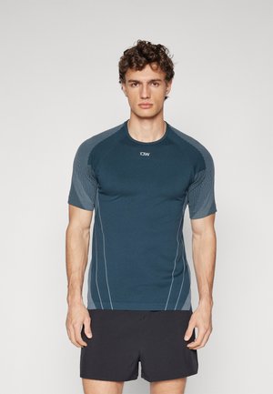 Navy blue athletic shirt with short sleeves, featuring contrasting textured shoulder panels and white accent stitching.