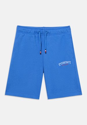 Kék, laza rövidnadrág gumis derékrésszel és húzózsinórokkal, oldalzsebekkel, a bal lábszáron "Tommy Hilfiger" logóval.
