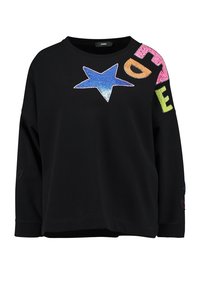 Czarna bluza z długim rękawem, z niebieską gwiazdą z cekinów i kolorowymi literami na ramieniu. Miękki materiał, luźny krój.