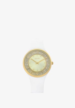White wristwatch with gold bezel, ivory dial, gold hands, and decorative crystal-like numbers around the edge, brand Liu Jo visible on dial.