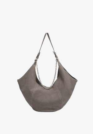 Gray suede hobo bag with a large opening, featuring a chain accent along the shoulder strap and seamless curved shape.