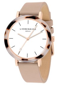 Rosaguldur ur med hvid skive, sorte timemarkører og en skive af skildpadde. Har en beige læderrem til lukning.