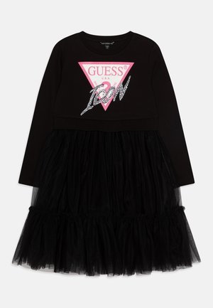 Abito nero a maniche lunghe con top aderente e gonna in tulle trasparente arricciata, caratterizzato da un logo triangolare rosa e dettagli in strass.
