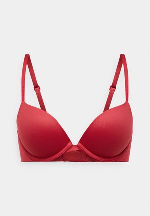 Sutien roșu căptușit cu bretele ajustabile, design fără cusături și un închidere cu cârlig și ochiuri în spate. Material moale cu o textură netedă.