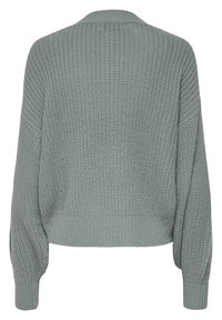Pull en maille de couleur vert clair avec un motif texturé, manches larges et ourlet côtelé. Doté d'un col classique et d'une coupe décontractée.