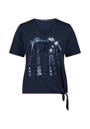 T-shirt bleu marine à manches courtes avec col en V, présentant un motif floral brillant sur le devant, un détail noué sur le côté gauche et un tissu doux.