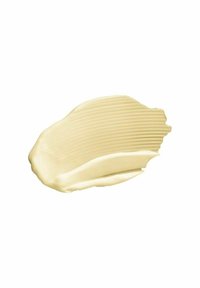 Krämig off-white produkt med en slät, glansig textur, med subtila ränder från appliceringen.