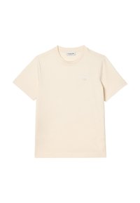 Camiseta corta de algodón color crema con mangas cortas. Presenta un cuello redondo y un sutil logo bordado en el pecho. Textura suave.