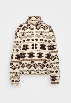 Mikina z fleecu v krémovej farbe s tmavohnedými a taupe geometrickými vzormi, vysokým golierom, polovičným zipsom vpredu a elastickými manžetami a lemom.
