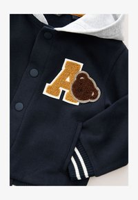 Selected, navy blue bear