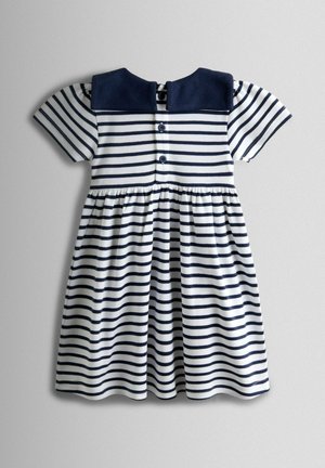 Csíkos ruha tengerészkék gallérral és rövid ujjal. Fehér anyag vízszintes tengerészkék csíkokkal. Hátul gombos lezárással.