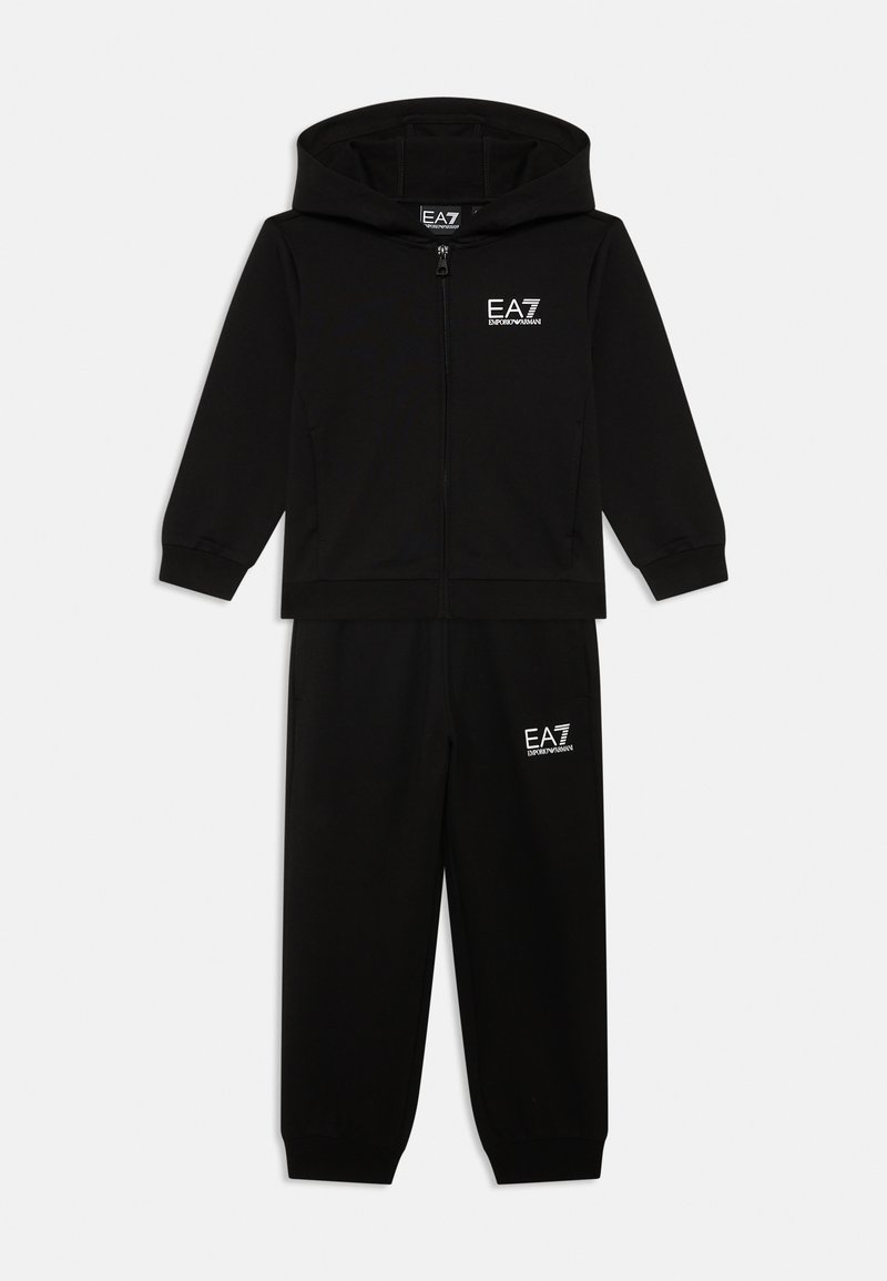 Black tracksuit with zip-up hoodie and elastic waistband pants. Features EA7 logo in white on both top and pants. Soft fabric, fitted design.