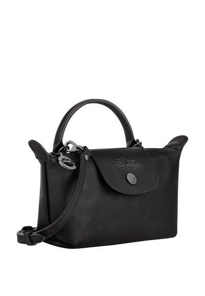 Black leather handbag with a structured shape, top handle, detachable strap, snap closure, embossed logo, and subtle stitching detail.