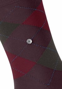 Skarpeta w burgundowym, ciemnoszarym i bordowym wzorze argyle, z niebieskimi wyszywanymi liniami i małą srebrną okrągłą zawieszką z napisem "Burlington The Original".