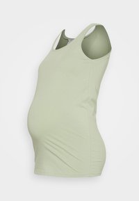 Top de maternidade verde claro com um design ajustado, decote redondo e estilo sem mangas. Feito de um tecido macio e elástico para conforto.