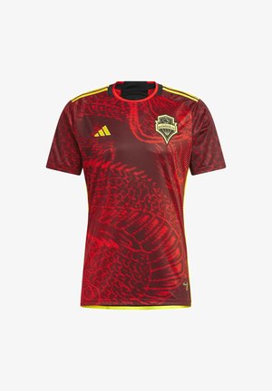 Maillot de football des Seattle Sounders FC rouge et noir avec logo Adidas jaune, bandes jaunes sur les épaules, et motif abstrait en forme de vague.