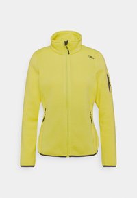 Helle gelbe Fleecejacke mit hohem Kragen, Reißverschluss auf der Vorderseite und schwarzen Akzenten. Verfügt über zwei seitliche Reißverschlusstaschen und eine Reißverschlusstasche am Arm.