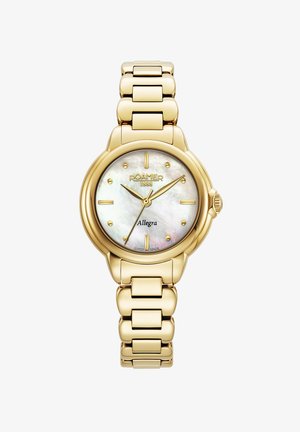 Zelta tonis rokas pulkstenis ar apaļu korpusu, mātes pērļu ciparnīcu, zelta rādītājiem un pulētu saiti. Iekļauta zīmola nosaukums un modeļa informācija.