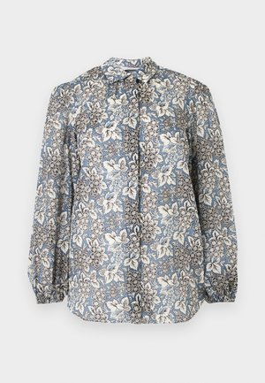 Μπλούζα με μακριά μανίκια σε μπλε, άσπρο και μαύρο λουλουδάτο σχέδιο, κουμπωτή μπροστά και με σούρες στα μανίκια σε ανοιχτό γκρι φόντο.