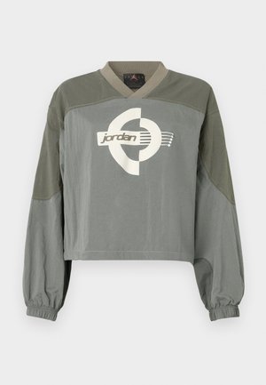 Κοντή μπλούζα με μακριά μανίκια και ελαστικές μανσέτες, σε απαλούς τόνους πράσινου-γκρι, με το λευκό λογότυπο Jordan στο κέντρο του στήθους.