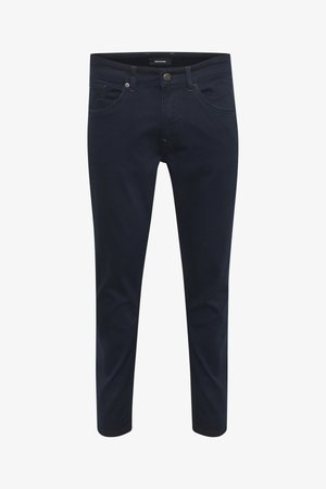 Marineblå denimbukser med slim fit, fem lommer, synlige sømme og metalknaplukning i taljen.