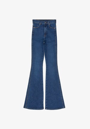 Flared blue denim jeans with a high waist, contrasting stitching, five pockets, and metal hardware. The legs widen from the knee down.