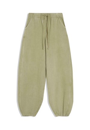 Pantaloni della tuta verde chiaro dal taglio ampio con vita elasticizzata, coulisse, tasche laterali e polsini elastici alle caviglie, mostrati su sfondo bianco.