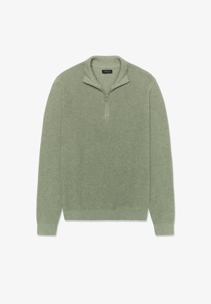 Világoszöld pulóver anyagból, texturált felülettel. Félzáras nyakkivágással és bordázott szegéllyel valamint mandzsettákkal. Egyszerű, letisztult dizájn díszítések nélkül.