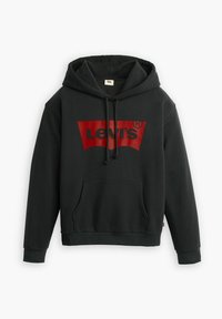 Sweat à capuche noir avec un grand logo Levi's rouge. Doté d'une poche avant, d'une capuche avec cordon de serrage, et de poignets et ourlet côtelés. Matière en mélange de coton.