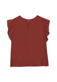 Blusa color ruggine con maniche a farfalla e chiusura a bottone a chiave sul retro, posata su uno sfondo bianco.