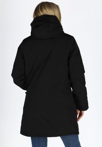 Black, hooded winter coat with a long, straight cut, made from smooth, water-resistant fabric. Features a front zip and side pockets.