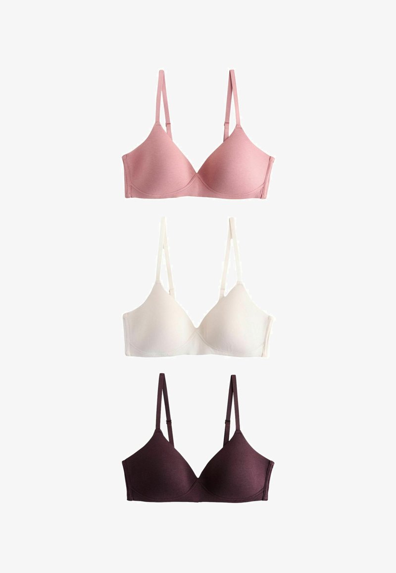 Tres sujetadores exhibidos verticalmente: uno en color rosa claro, uno blanco y uno morado oscuro. Están hechos de una tela suave, con tirantes ajustables y copas sin costuras.