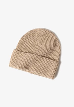 Beige knit beanie with a ribbed texture, featuring a rolled cuff and smooth top, made of soft material for comfort and warmth.