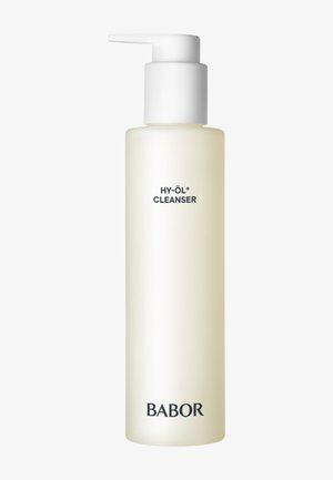 Bouteille cylindrique transparente avec une pompe blanche. Contient un nettoyant jaune clair étiqueté "HY-ÖL CLEANSER" avec "BABOR" imprimé en bas.