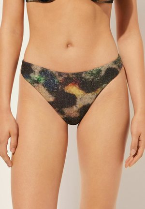 Czarny dół bikini z metalicznym, wielokolorowym wzorem w kropeczki, niski stan i gładka faktura.