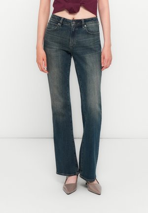 Dark wash denim jeans with a straight-leg design, featuring front pockets, a belt loop waistband, and slight fading on the thighs.
