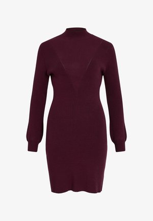 Burgundska pletenina obleka z visokim ovratnikom, dolgimi napihnjenimi rokavi in trikotno obliko v obliki črke V na prsih. Mehek material, prilegajoča silhueta.